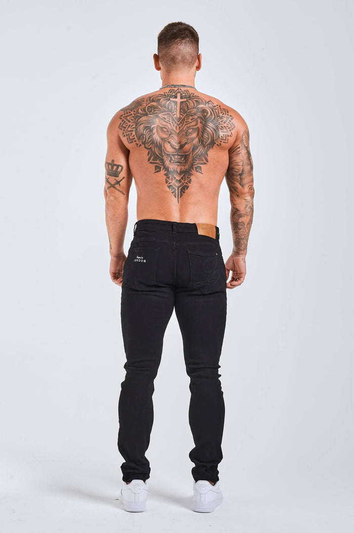 SLIM FIT JEANS 2.0 GEBORDUURDE DENIM MET PRINT - ZWART