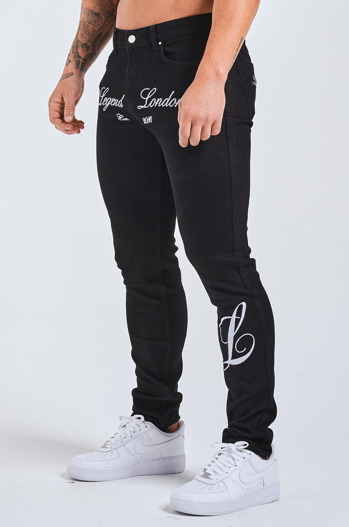 SLIM FIT JEANS 2.0 GEBORDUURDE DENIM MET PRINT - ZWART