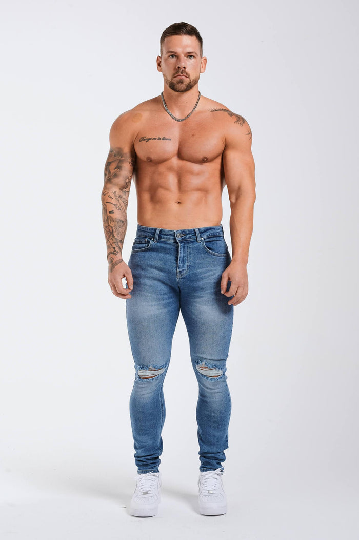 SLIM JEANS 2.0 ESSENTIËLE GESCHEURD - BLAUWE WASH