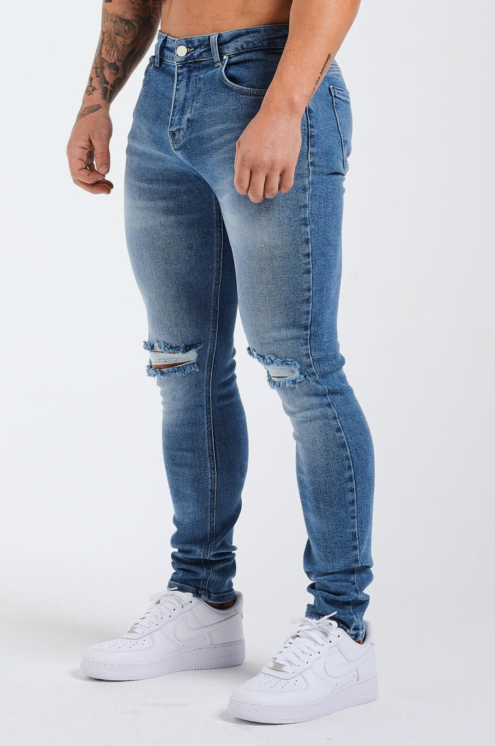 SLIM JEANS 2.0 ESSENTIËLE GESCHEURD - BLAUWE WASH