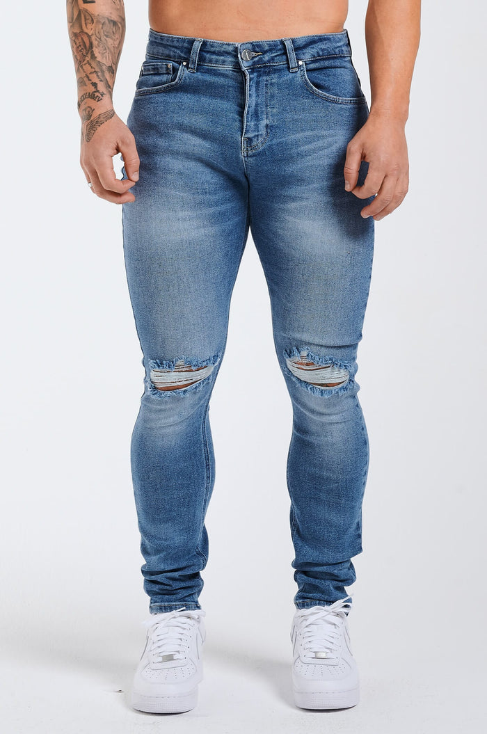 SLIM JEANS 2.0 ESSENTIËLE GESCHEURD - BLAUWE WASH