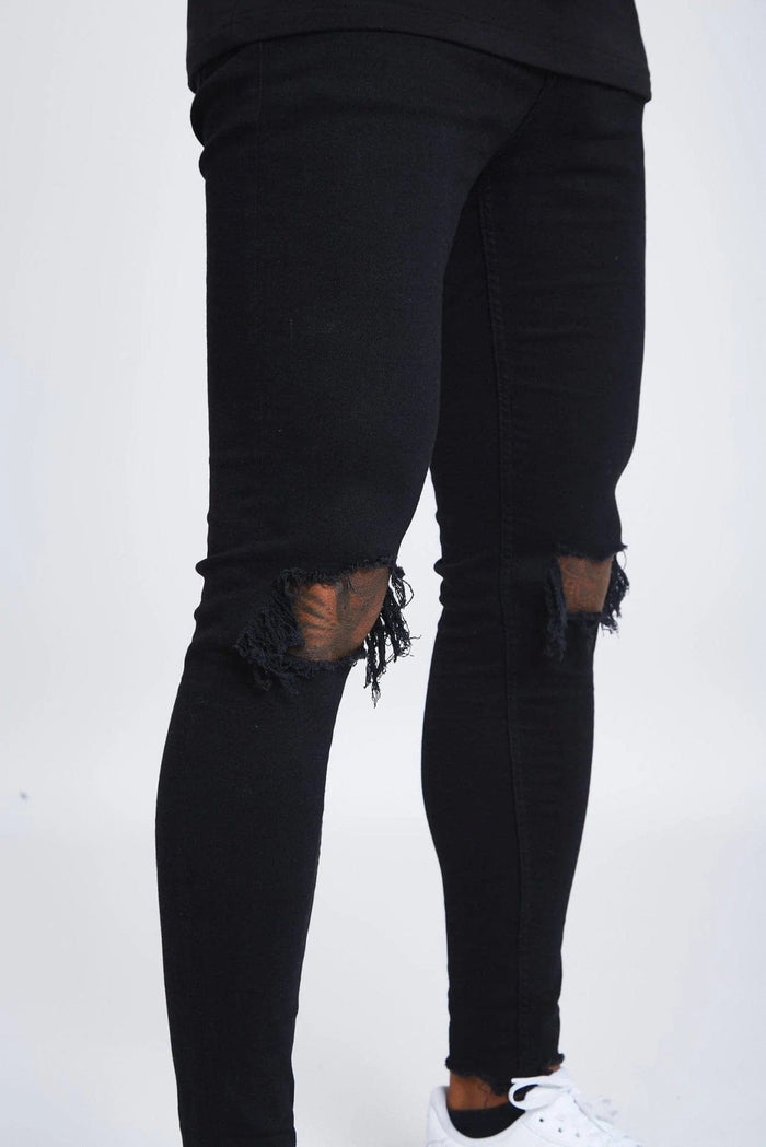 SKINNY FIT JEANS DESTROYED KNEE - BLACK