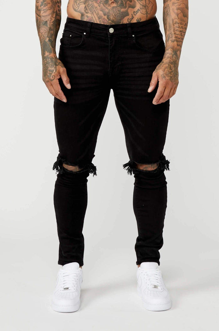 JEANS PREMIUM SKINNY FIT-RODILLA NEGRA DESTRUIDA