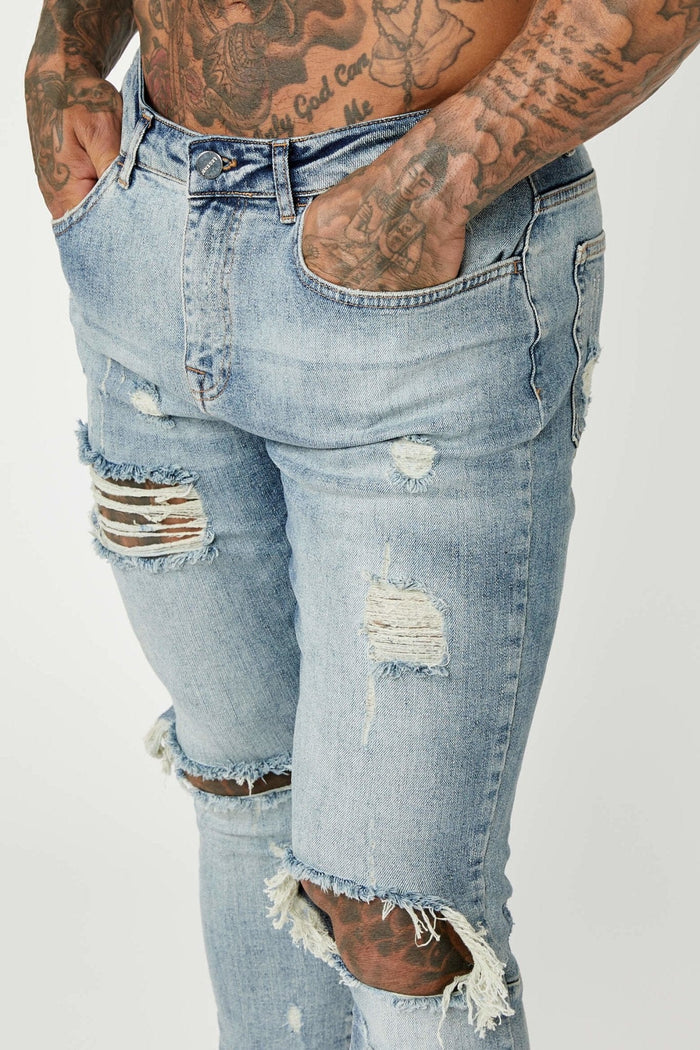 SKINNY FIT JEANS - MIDDENBLAUW GESCHEURD & GEREPAREERD