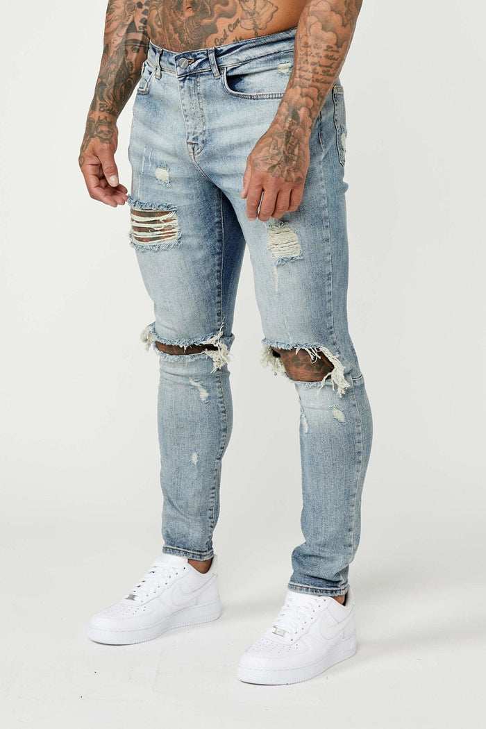 SKINNY FIT JEANS - MIDDENBLAUW GESCHEURD & GEREPAREERD