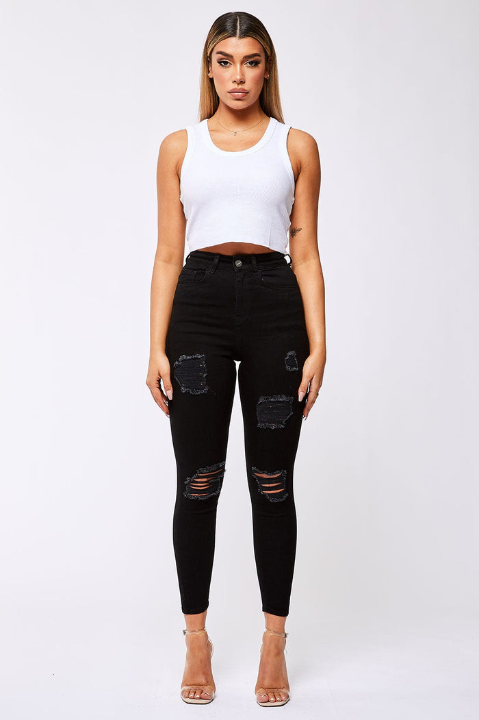 SKINNY JEANS GESCHEURD EN GEREPAREERD - ZWART