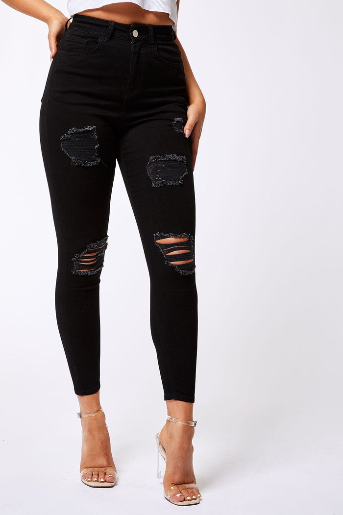 SKINNY JEANS GESCHEURD EN GEREPAREERD - ZWART